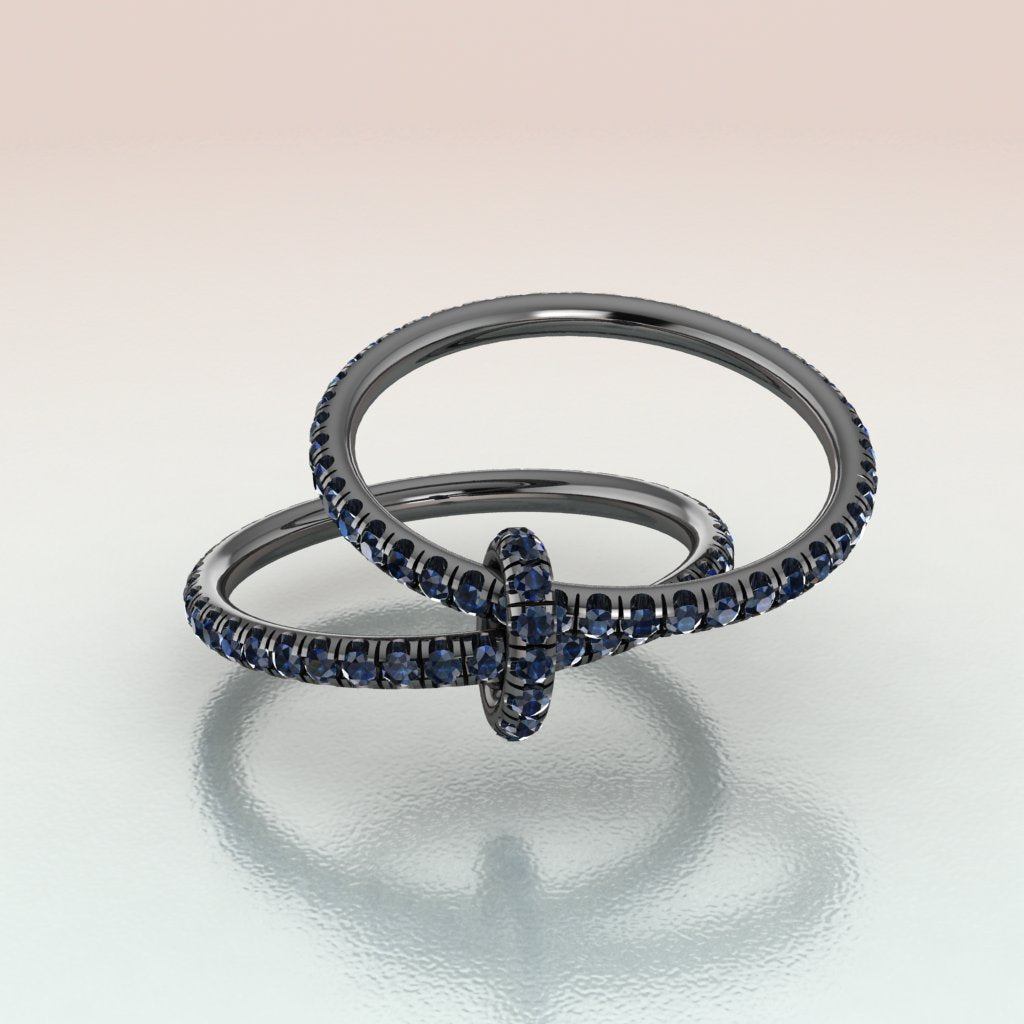 14k white gold black rhodium bands connected with a link  with blue sapphires