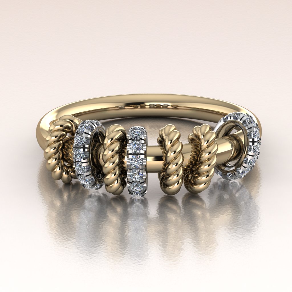 Gold ring with twist rope links and diamond accents links on a light background