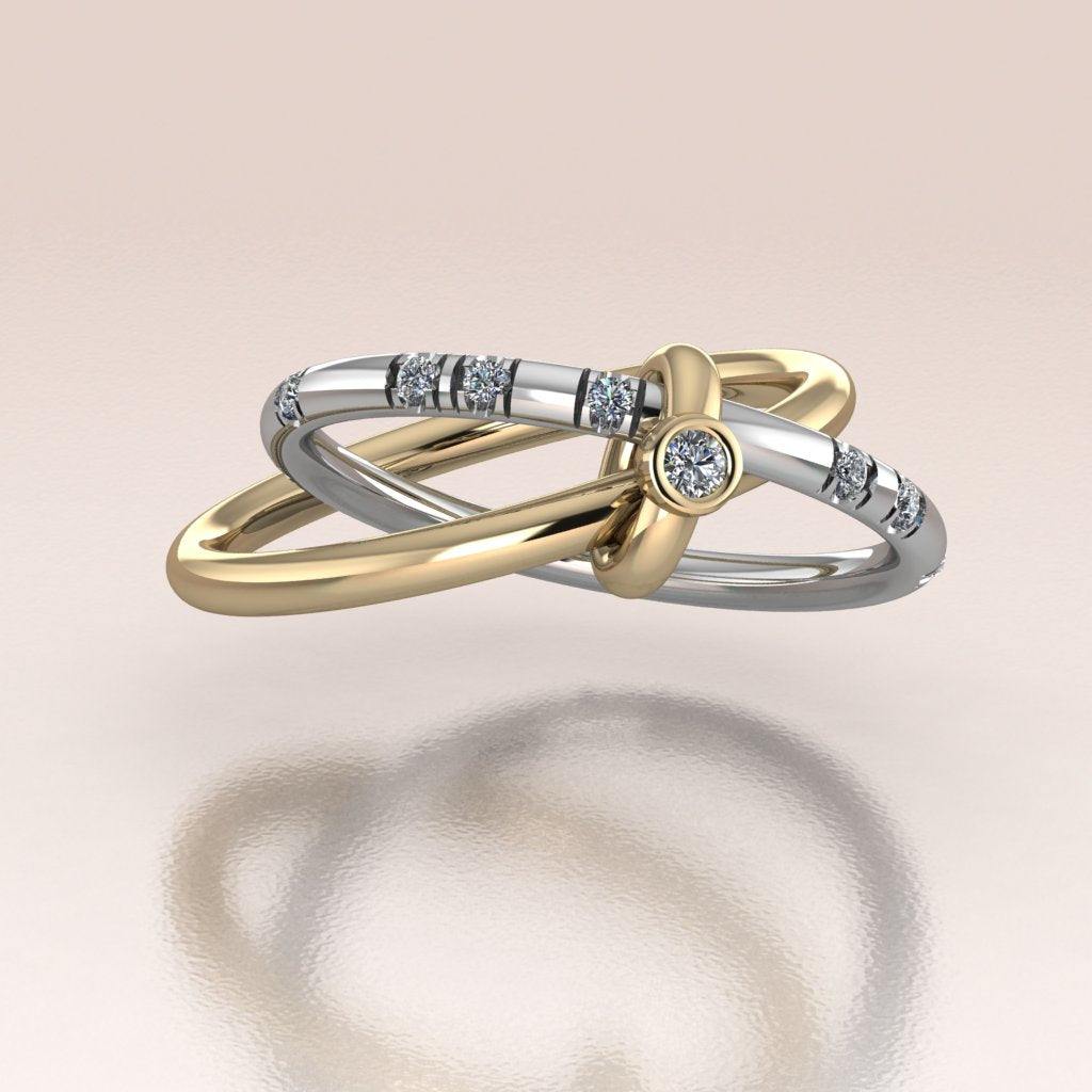 two gold bands stacked together by gold link 