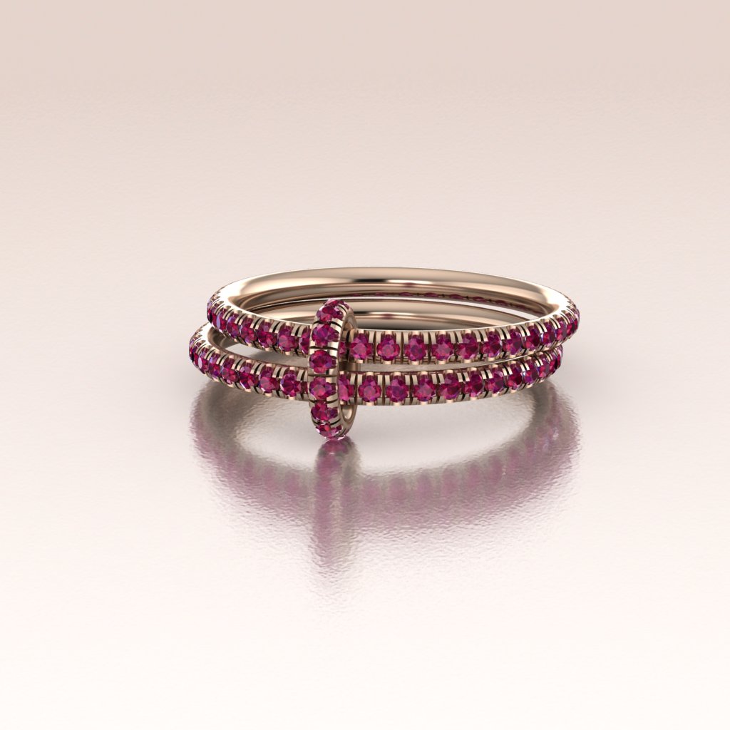 two luxury rose gold eternity bands with red rubies linked by a rose gold ruby jump ring