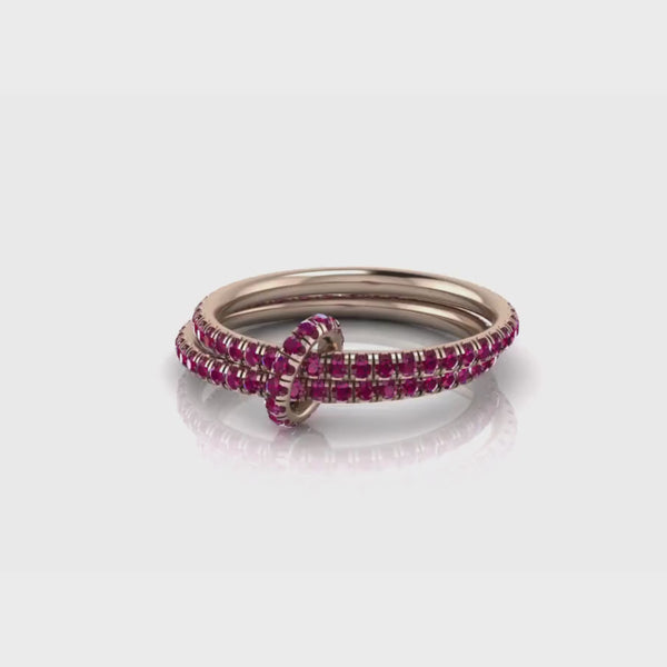 two rose gold rubies bands connected by a rose gold bridge with rubies video